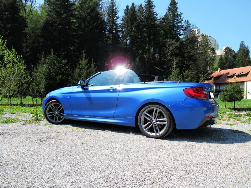Roof down, windows up, side view